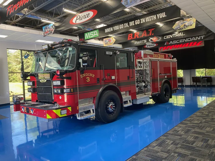 Front-left exterior view showing cab corner and side profile