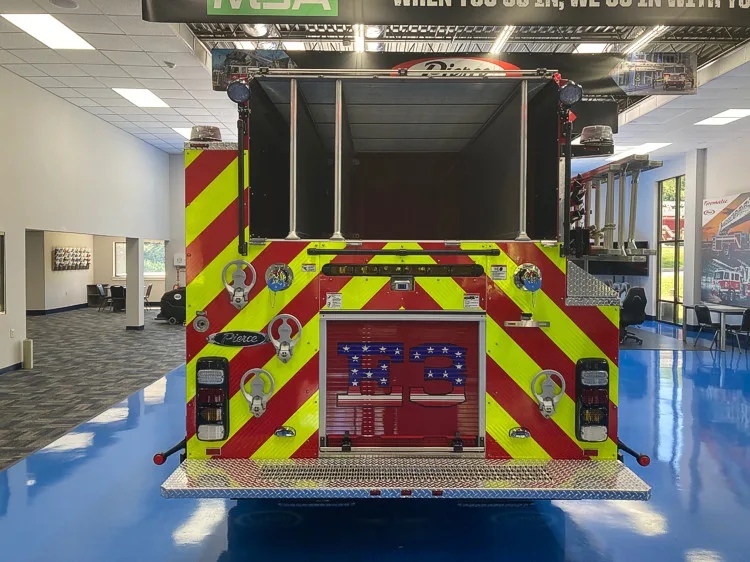 Rear view showing red-and-yellow chevrons and rear center panel