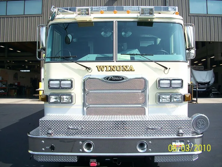 Head-on front view showing grille, windshield, warning lights, and front bumper intake ports.