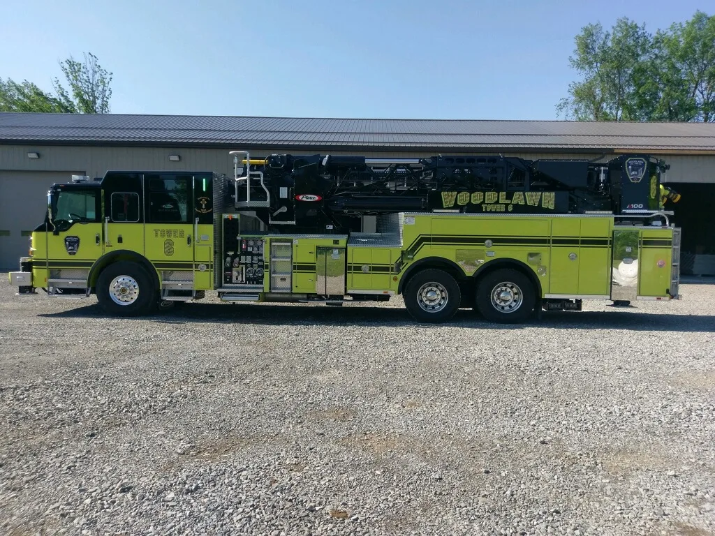 Driver-side full profile showing extended body compartments and axles