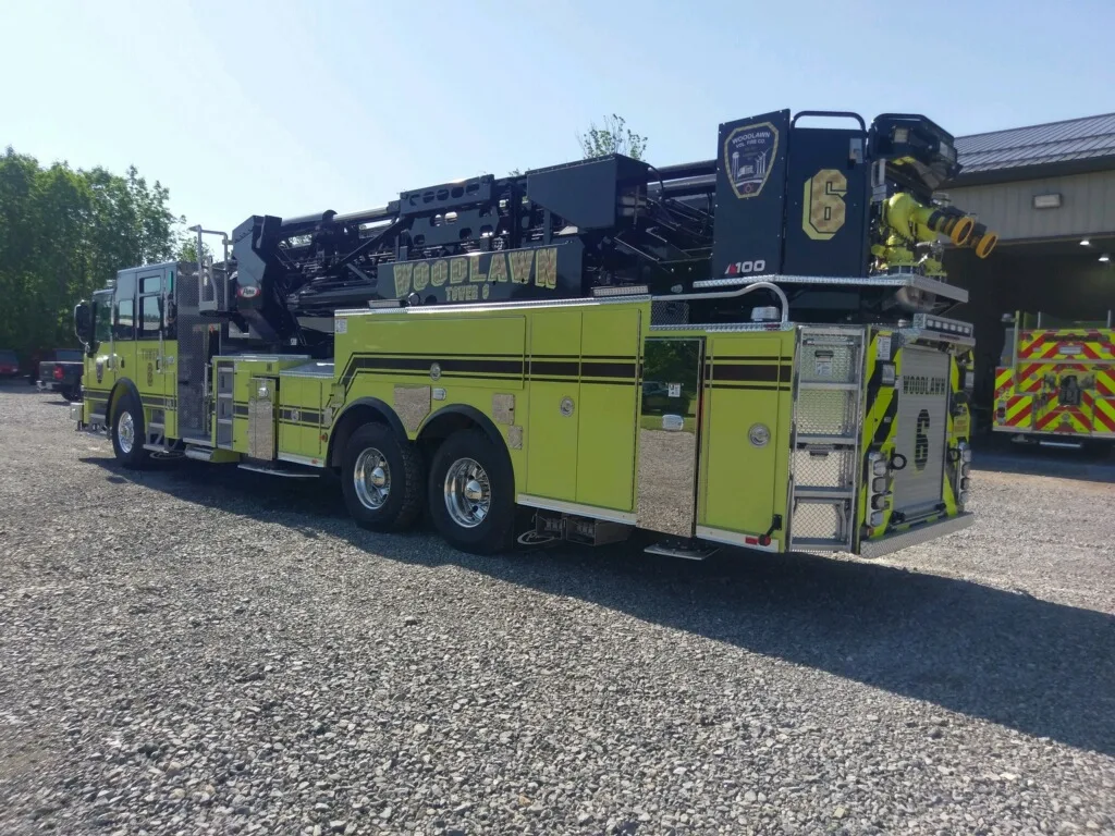 Rear-right exterior view showing ladder bed, rear body, and wheel area