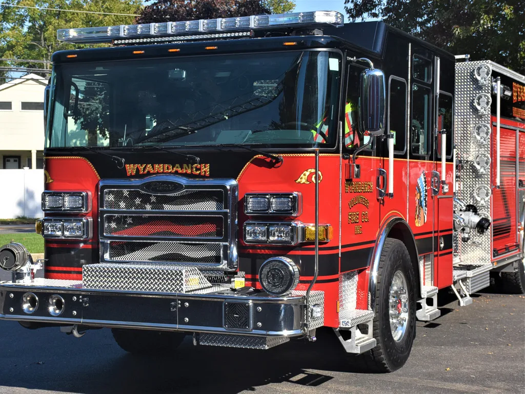 Head-on front view showing grille, bumper intakes, and warning lights