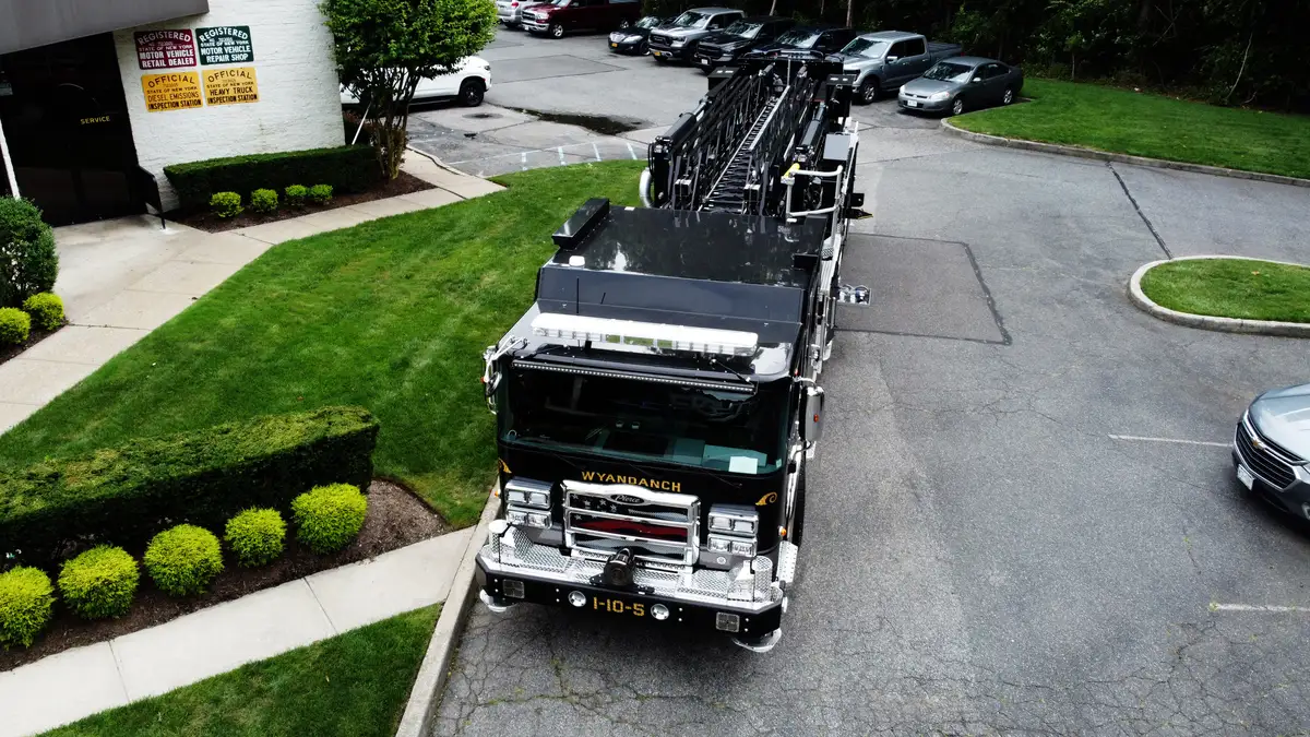 Aerial top-down side view showing full apparatus layout and wheel positions