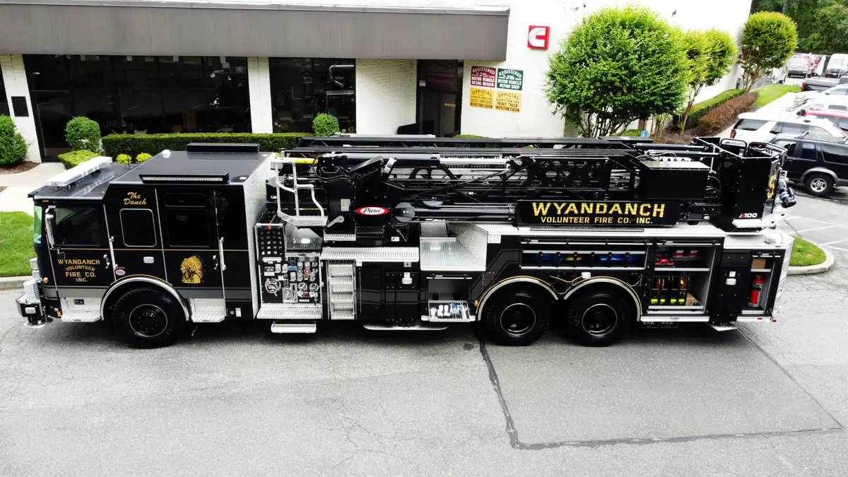 Aerial top-down rear-quarter view showing rear deck and outriggers