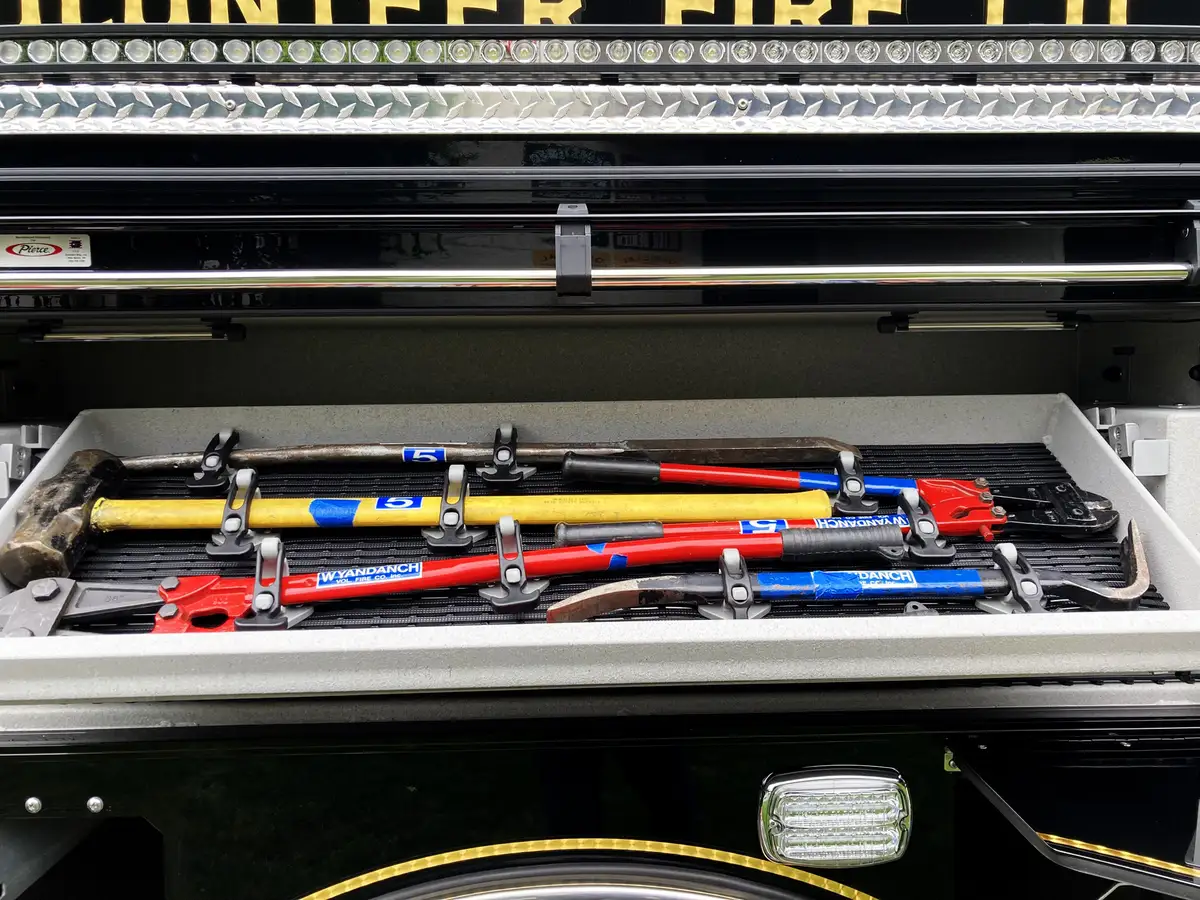 Wheel and suspension close-up showing rear axle and tire tread