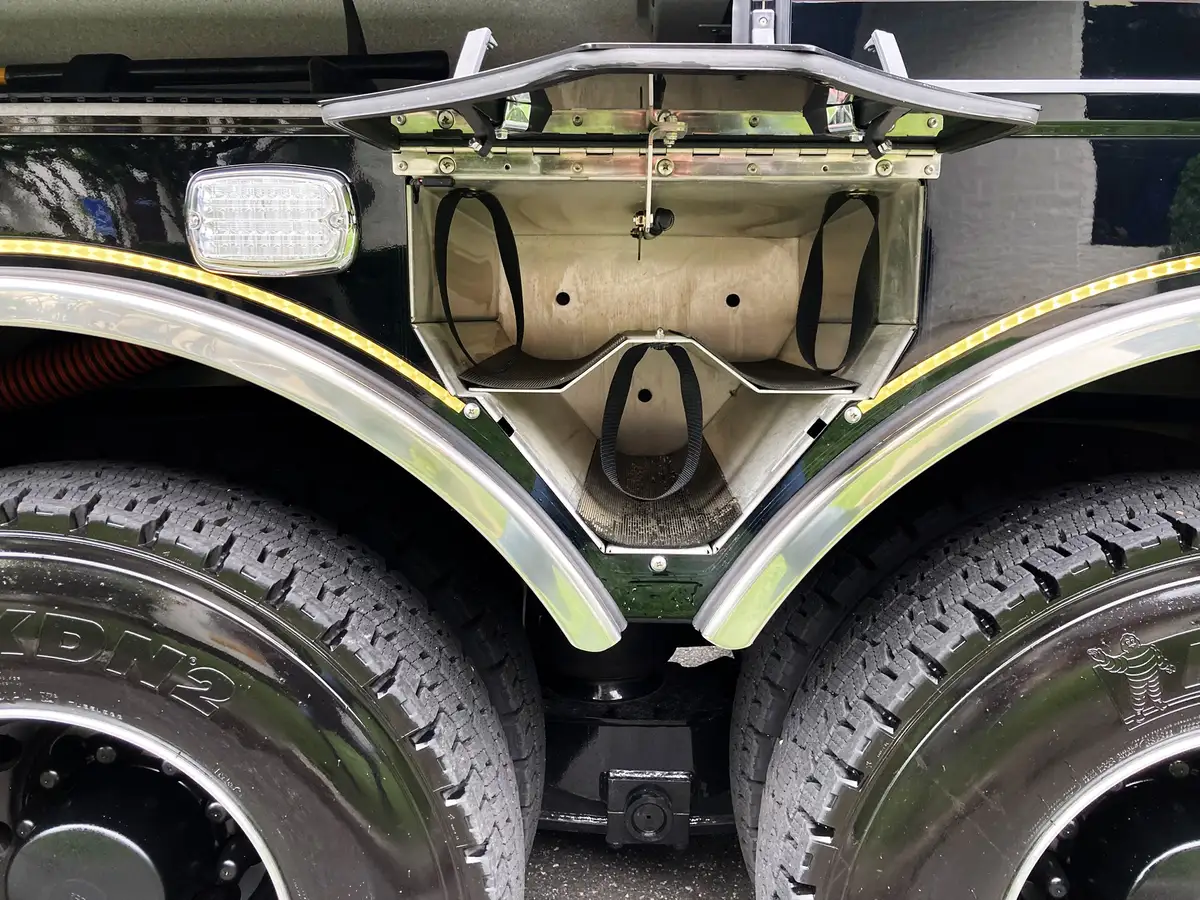 Open side compartment showing narrow vertical storage channel