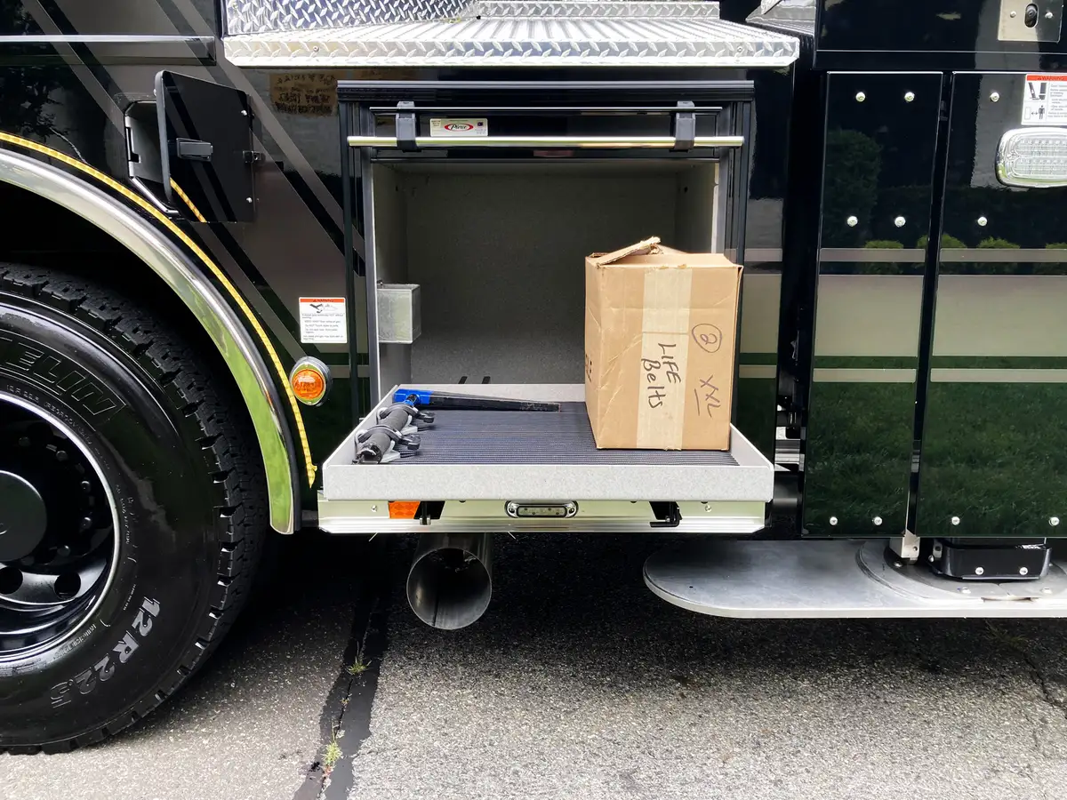 Rear view showing open side doors and rear ladder storage bay