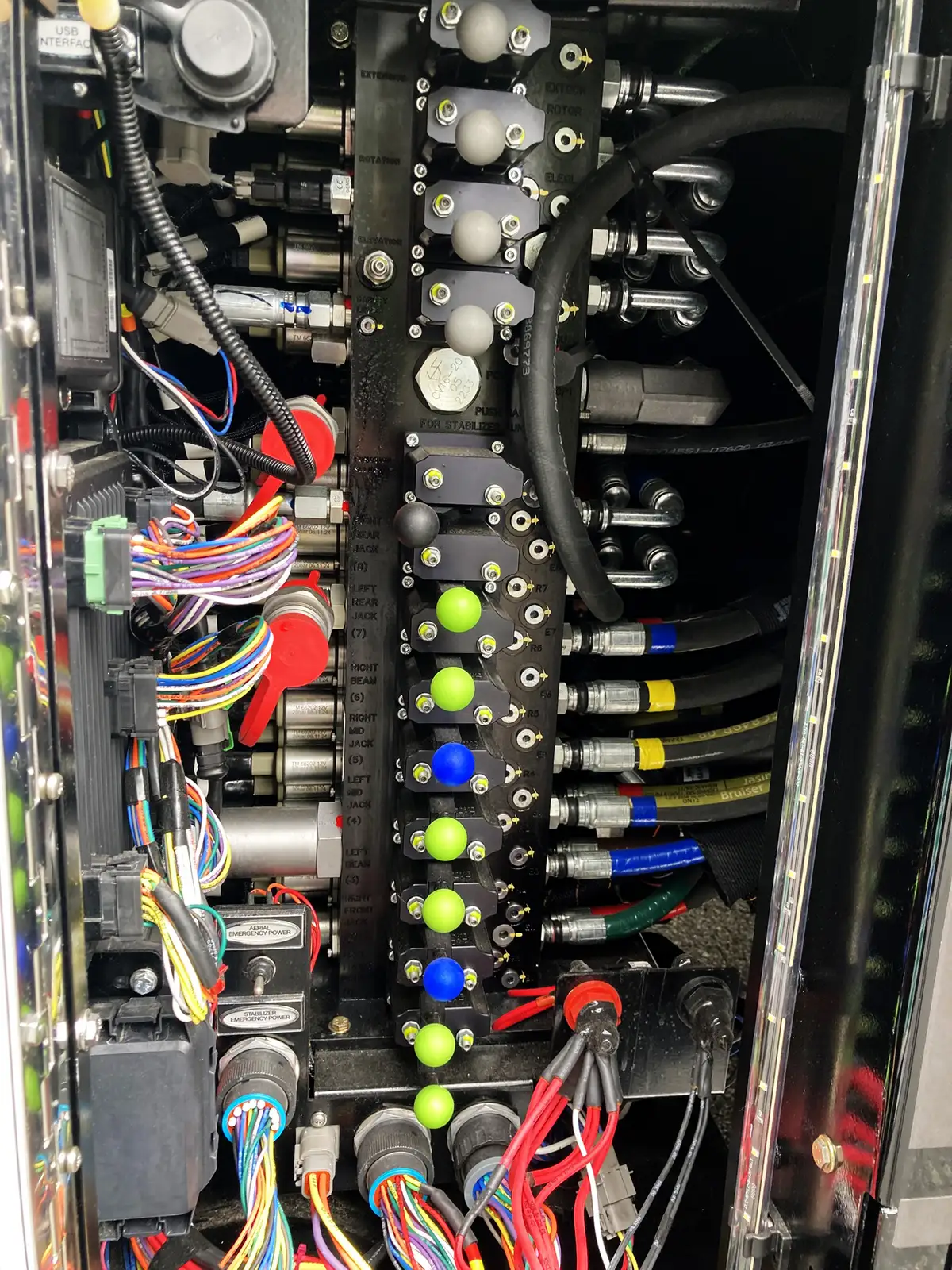 Driver-side profile view showing side logo lettering and tandem wheel area