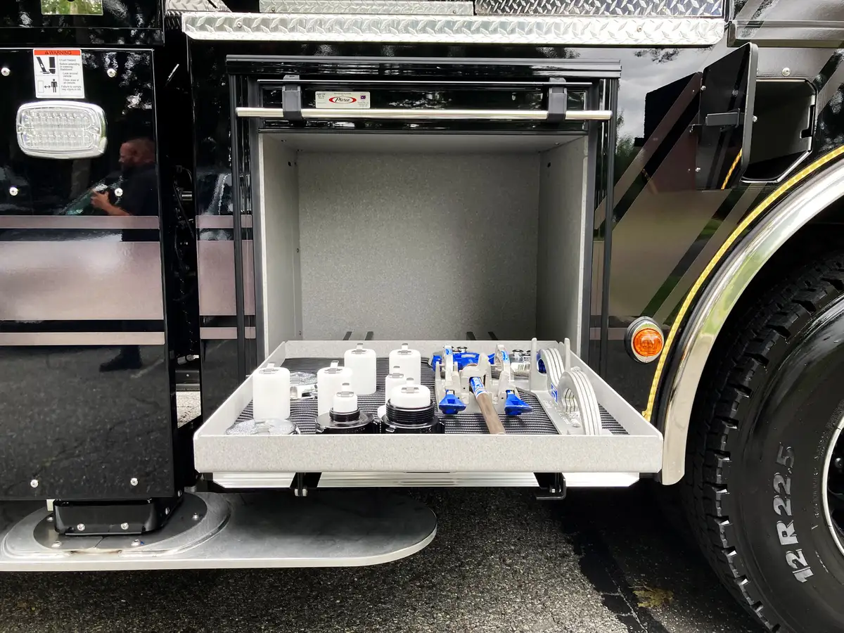 Front bumper corner and outrigger area close-up with stabilizer hardware