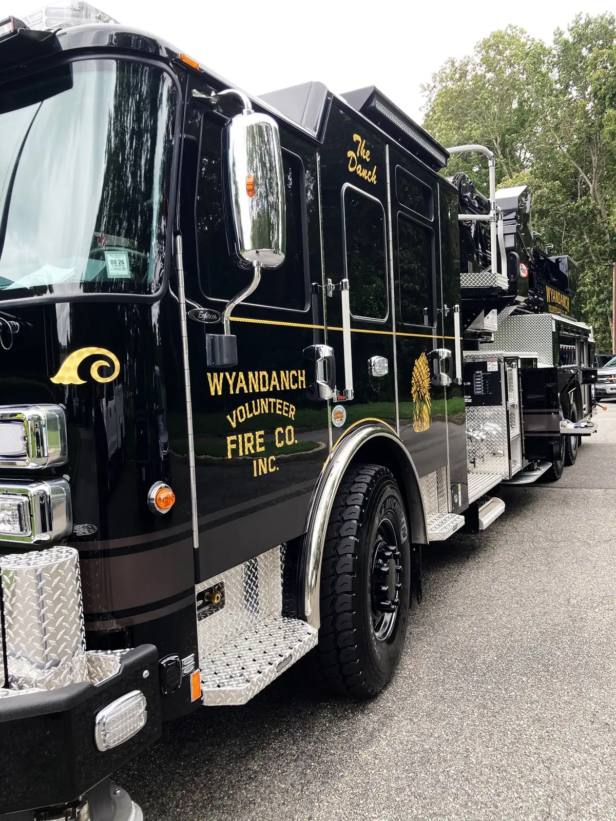 Front suspension area close-up showing axle and steering components