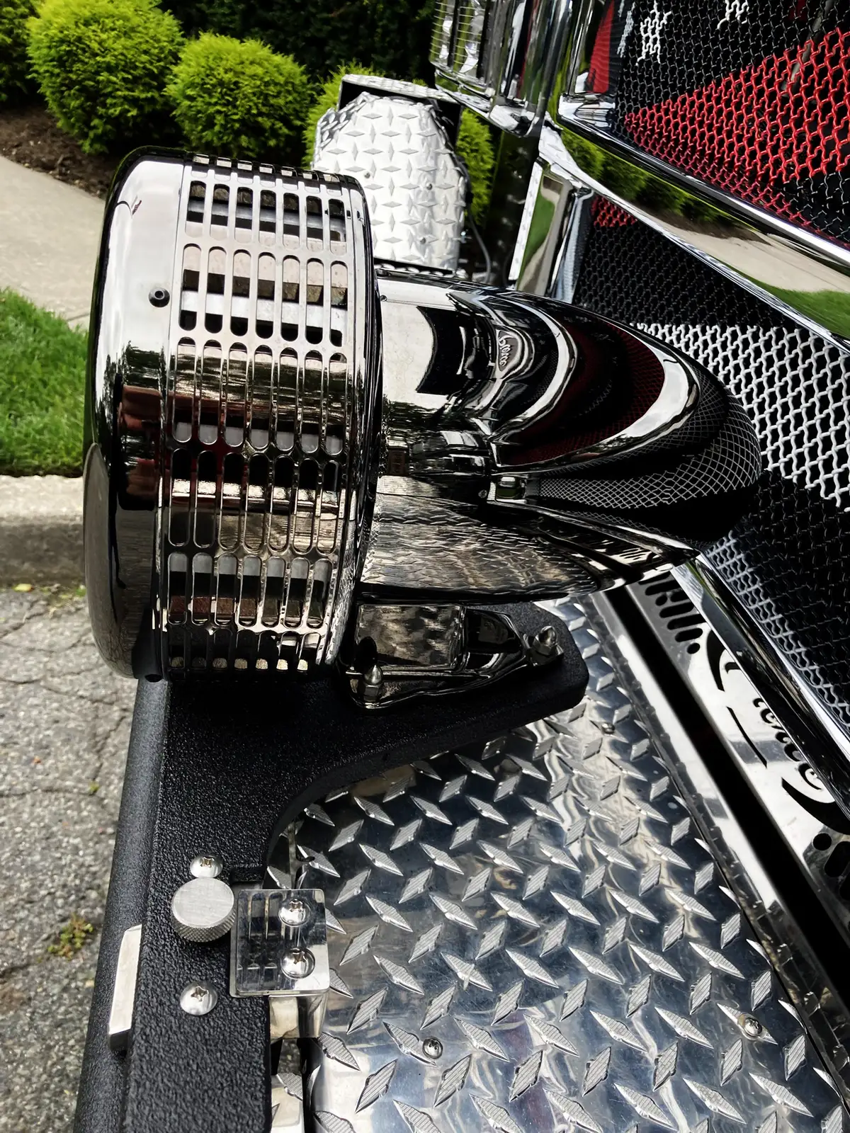 Front-right exterior close-up showing bumper corner and polished trim