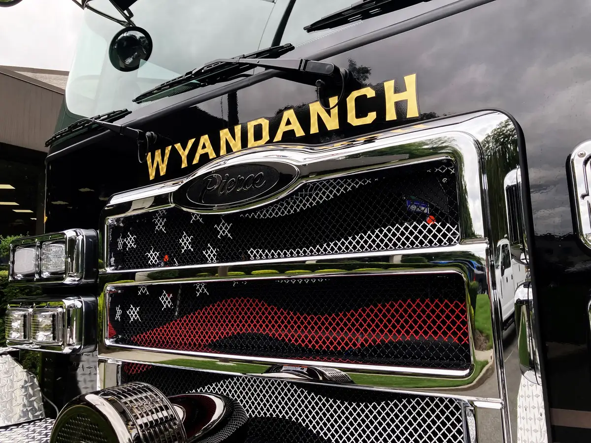 Front bumper marker-light close-up showing green LED indicator