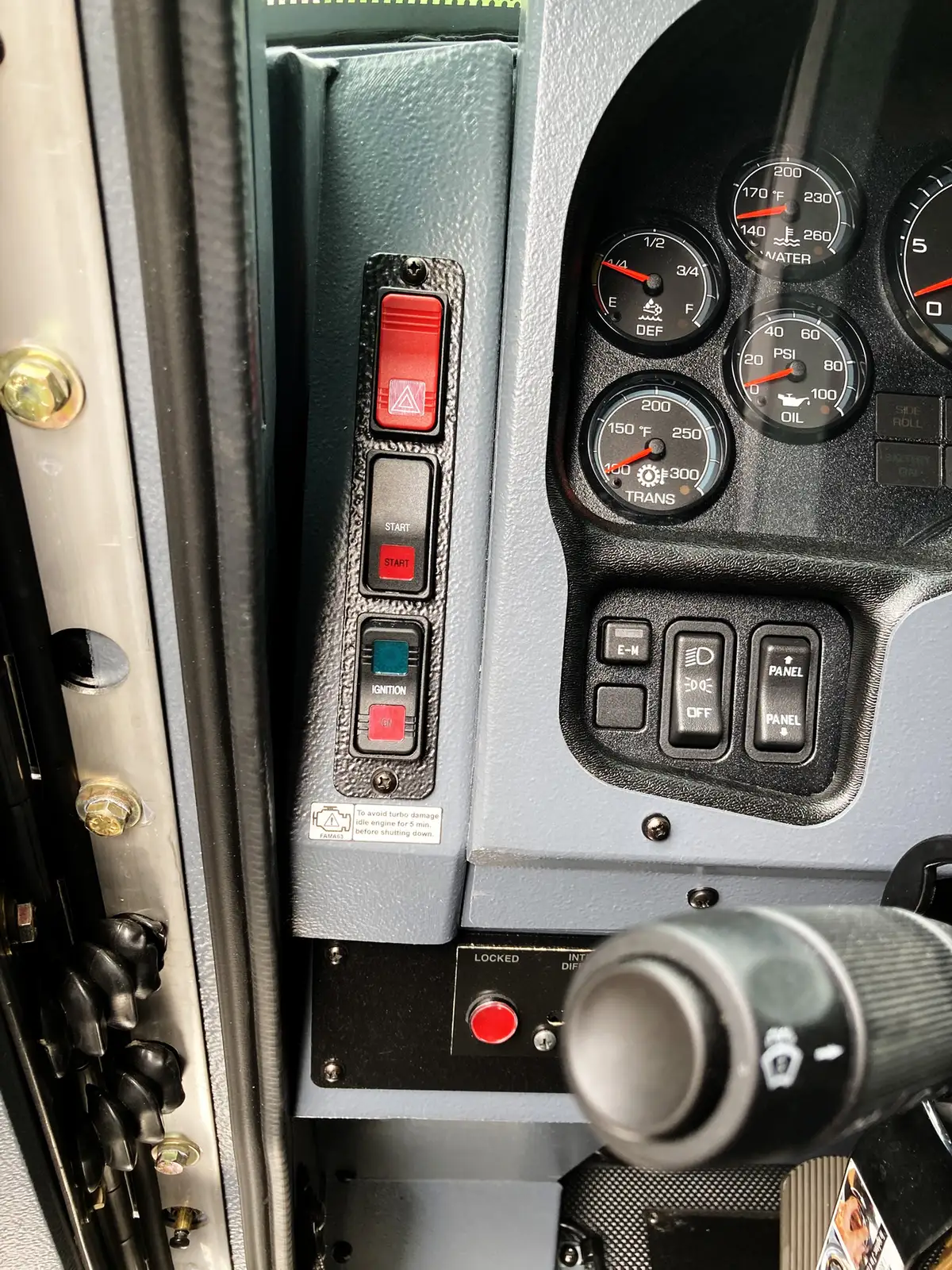 Side window view showing front seat and cab control area