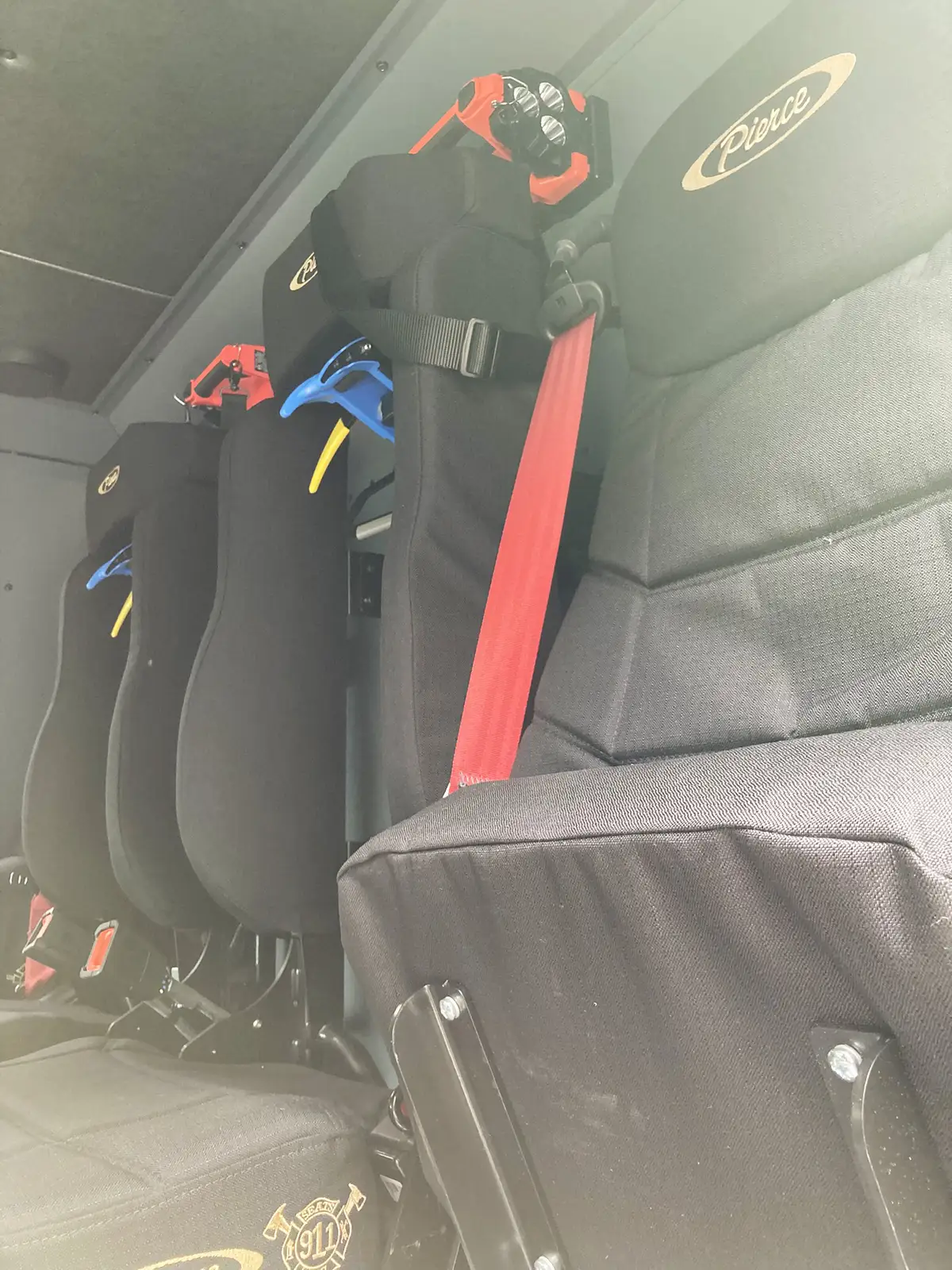 Cab interior view showing steering wheel and center dash controls