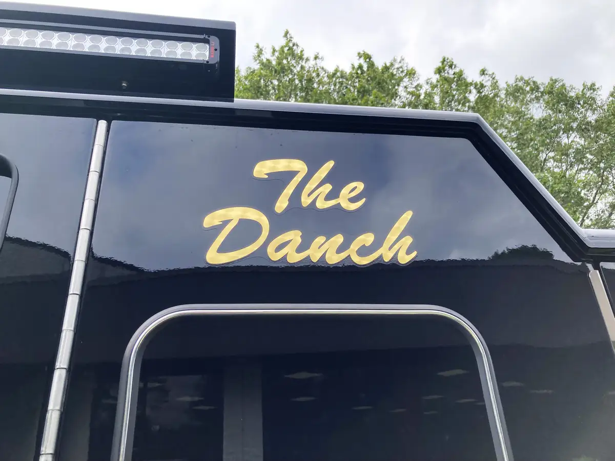 Cab side lettering close-up on black body panel