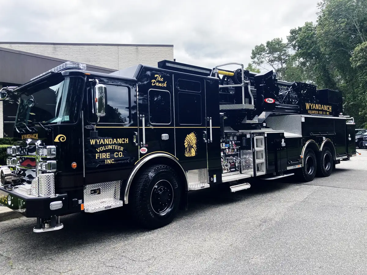 Front-left three-quarter view showing cab and side body compartments