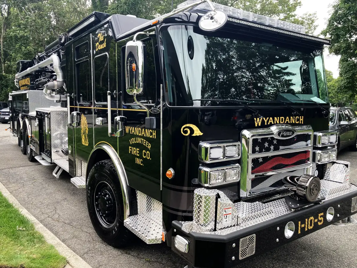 Front-right exterior view showing grille, bumper, and side body