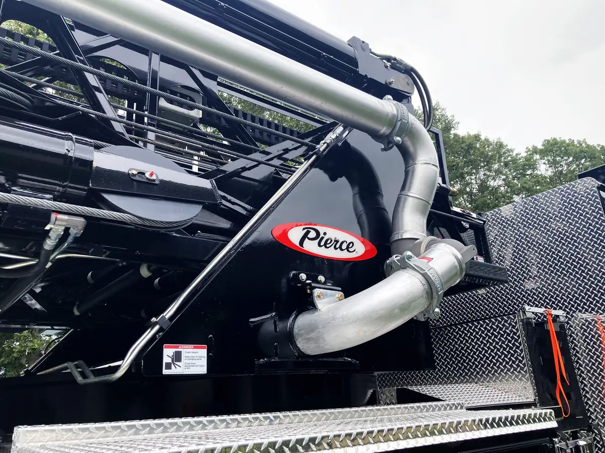 Rear-right exterior view showing side body, rear deck, and open compartments