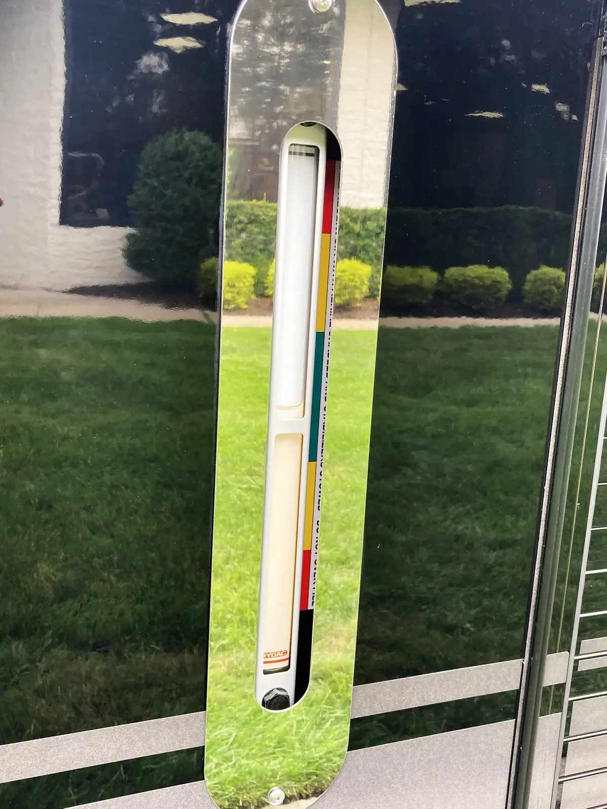 Outrigger pad close-up showing deployed stabilizer foot on grass