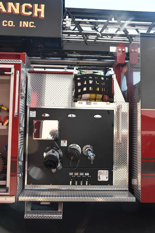 Open pump-side panel showing gauges, valves, and intake connections