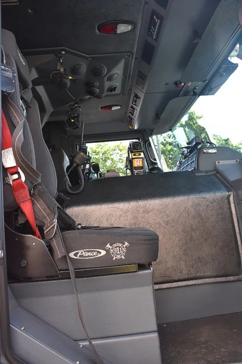 Cab interior side view showing rear seat and side wall panel