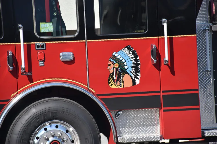 Cab door close-up showing profile logo and front wheel area
