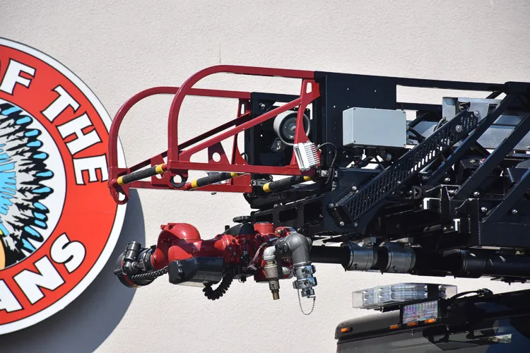 Ladder tip close-up showing red bucket framework and aerial sections