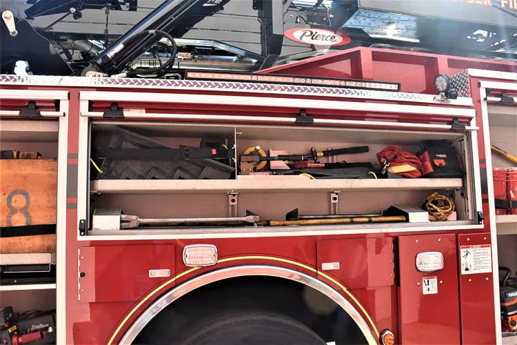 Open long side compartment showing mounted tools and equipment channels