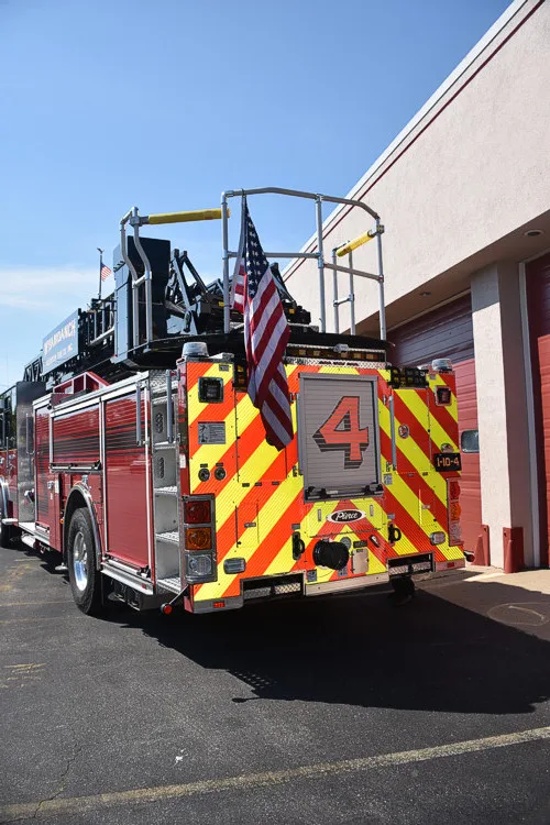 Rear-right exterior view showing chevrons and side body compartments