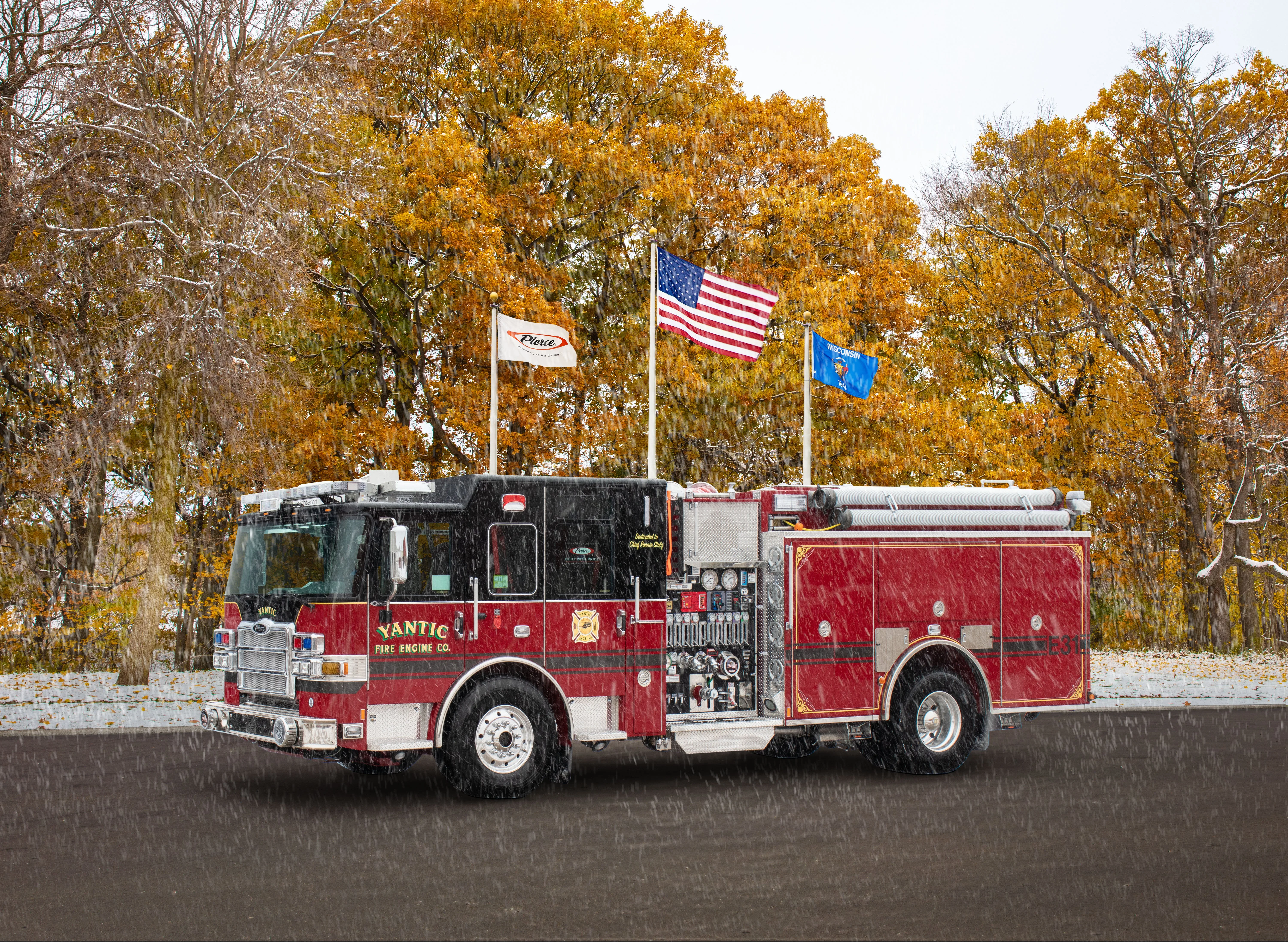 Yantic fire engine driver-side profile with snow and visible pump panel controls