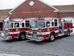 Wide front-left thumbnail view of the two-pumper lineup at the station.