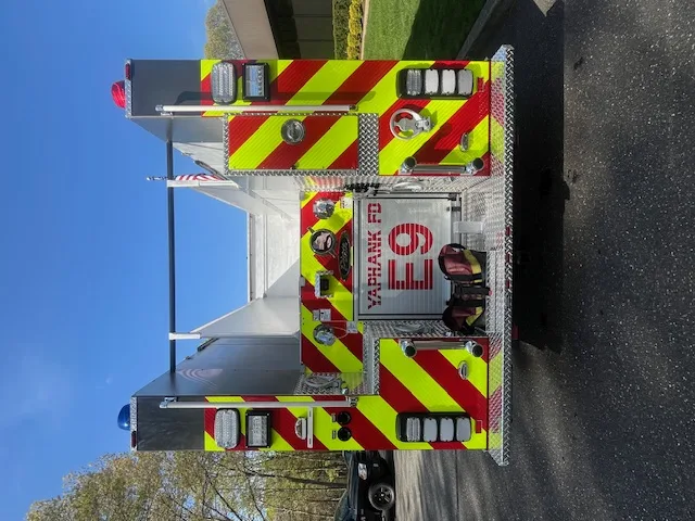 Cab interior view showing center console, controls, and rear-facing crew seating