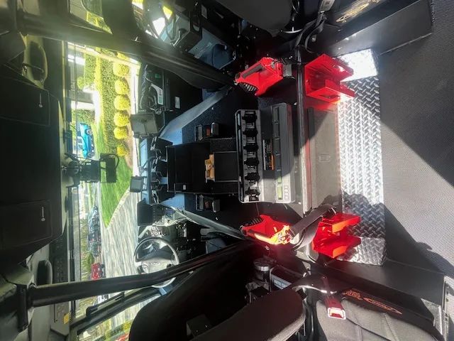 Open side compartment close-up showing mounted SCBA pack and storage tray