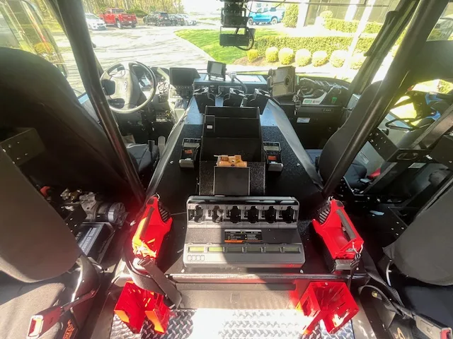 Cab interior view showing command console, seats, and dashboard controls